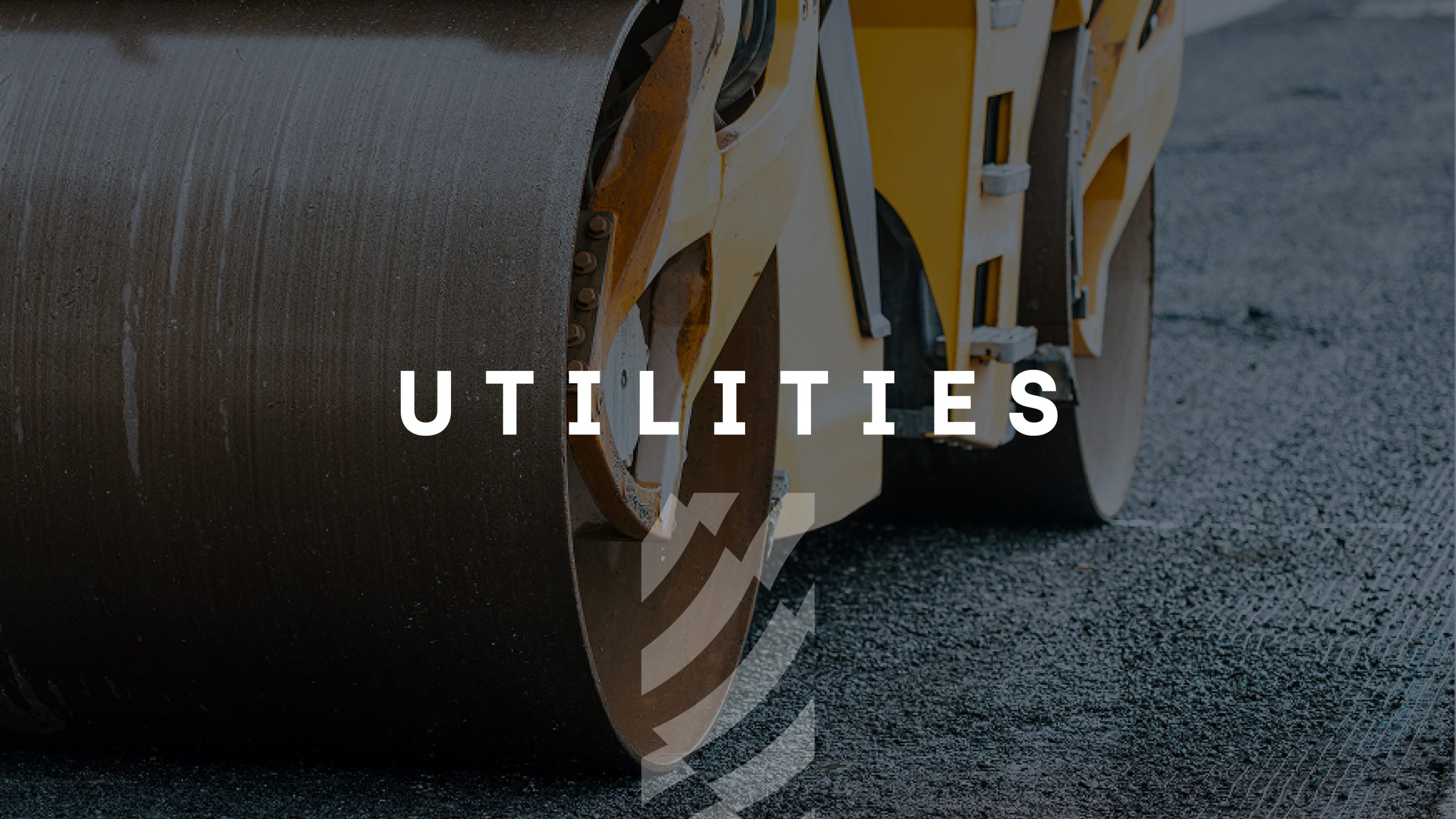 Browne Group - Close-up of a road roller smoothing asphalt, with the word 