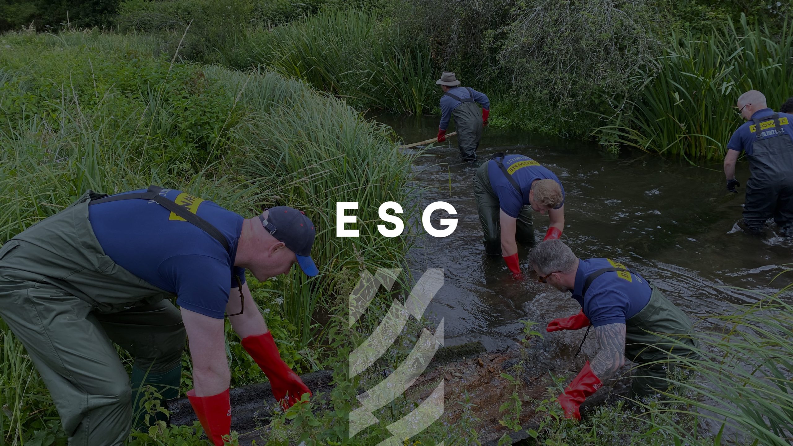 Browne Group - Four people in waders and red gloves clean a stream surrounded by green vegetation; text reads 