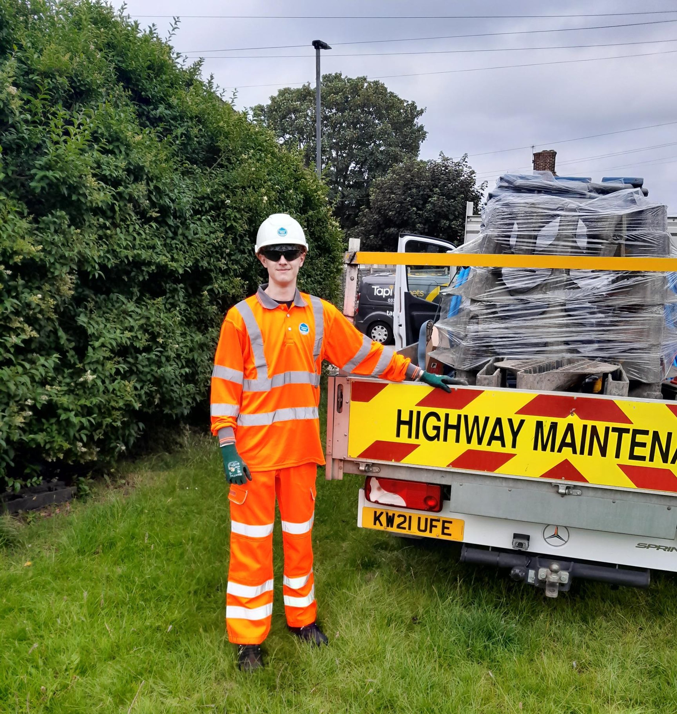 Browne Group - A worker in orange hi-vis gear stands by a 
